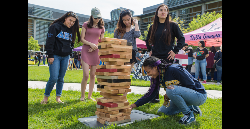 Students playing giant Jenga during BobCat Day 2017