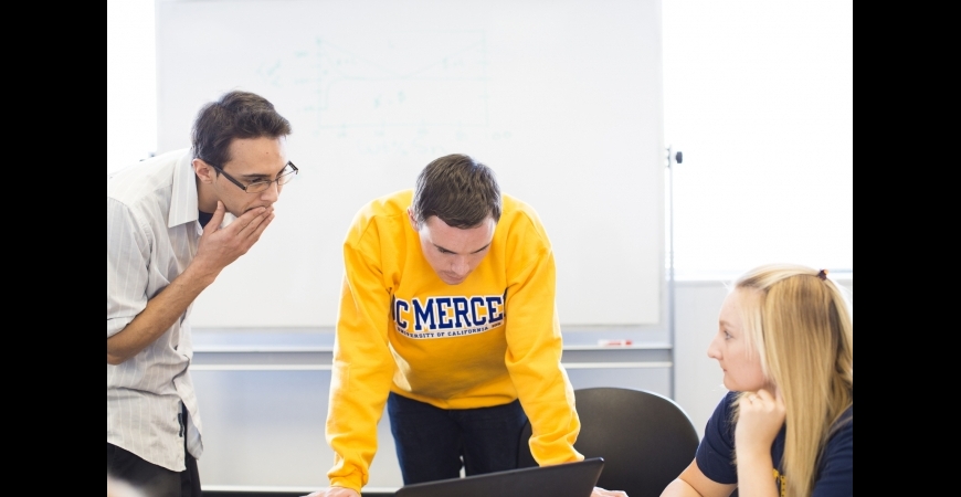 Students conversing during a tutoring session.